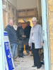 Church warden pictured with the builders. 18 October 2023
