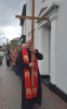 Following the cross up the High Street to the Parish Church.
