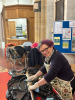 Lynda polishing the processional cross.