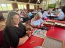 On the next table there was a wooden jigsaw puzzle Moira had discovered.